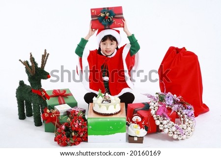 Xmas Kids sitting and raising Christmas gift on white background