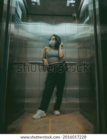 Indoor Photography inside Elevator in a cinematic Hollywood style tone.