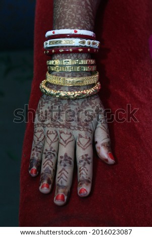 Mehendi on beautiful lady hands with dark background. Wedding mehendi, festival mehendi in India.