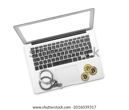 Laptop, bitcoins and handcuffs on white background. Hacking concept