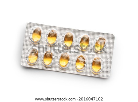 Blister package with fish oil capsules on white background
