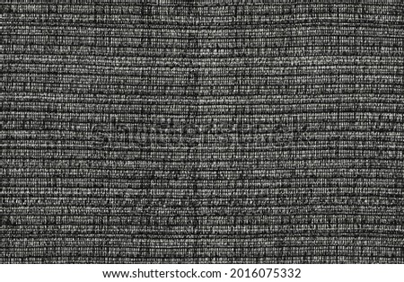 Close-up of the dark grey textile texture, background and wallpaper. The texture of dark grey fabric textile upholstery of furniture. High-quality photography.