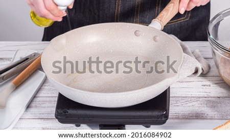 Step by step. Frying french toast in a nonstick frying pan. Royalty-Free Stock Photo #2016084902