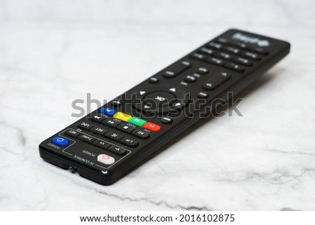Taking high key photography using tv remote as an object
