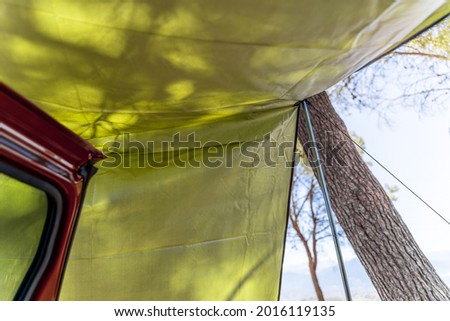 awning mounted on car in the forest