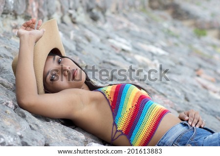 Girl resting on stones
