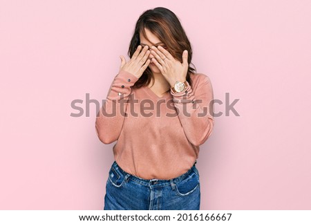 Young plus size woman wearing casual clothes and glasses rubbing eyes for fatigue and headache, sleepy and tired expression. vision problem 