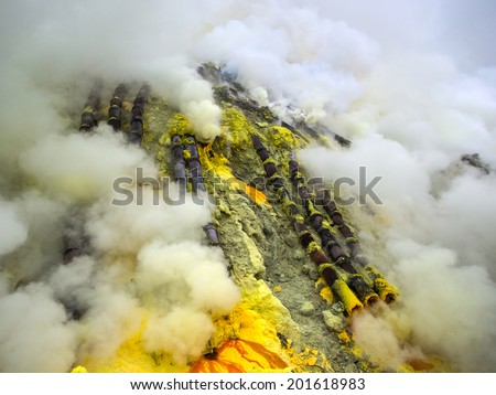 Ceramic pipes used for sulfur mining inside the crater of Kawah Ijen volcano, East Java, Indonesia. 