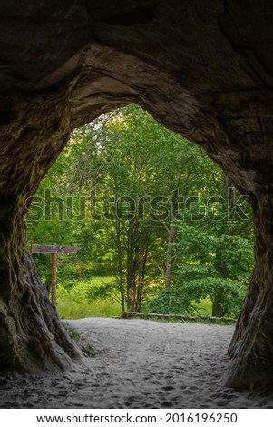 Out of focus photo taken from Helme caves on a sunny summer day. Located in the manor park of the same name, the Helme caves, are an unrivalled sight in Estonia. 