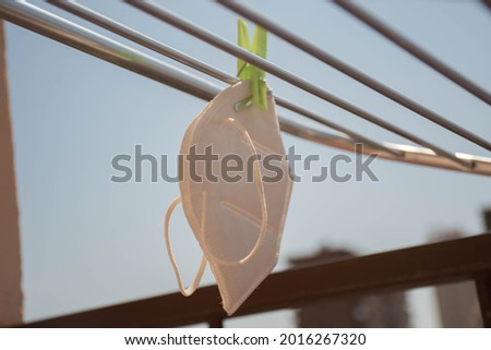 
FPP2 mask lying in the sun after being washed Royalty-Free Stock Photo #2016267320