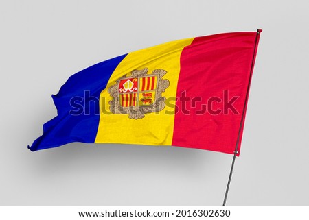 Andorra flag isolated on white background. National symbol of Andorra. Close up waving flag with clipping path.