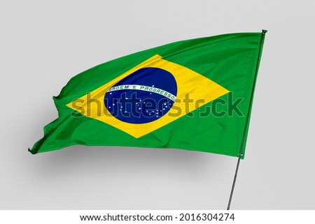 Brazil flag isolated on white background. National symbol of Brazil. Close up waving flag with clipping path.