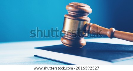 the judge's hammer and the book on the table