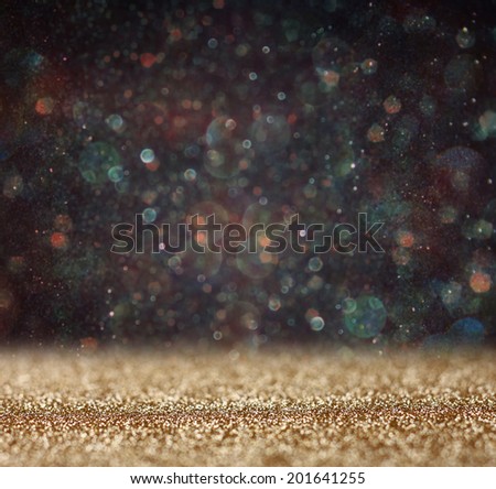 glitter vintage lights background. gold and black. defocused