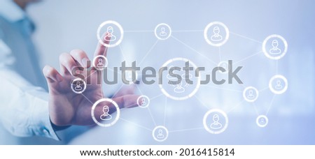 Businessman holding HR Human ,people icon on the graph Screen of a media screen, Technology Process System Business with Recruitment, Hiring, Team Building. Organisation structure concept.