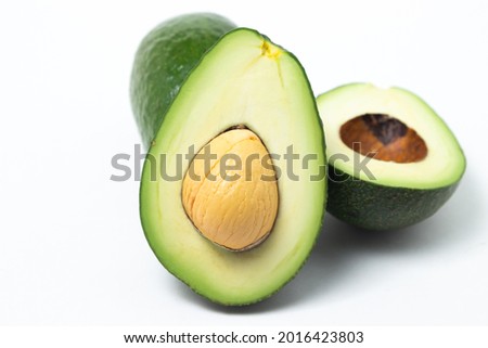 Avocado on a white background. Avocado cut in half