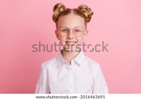 Photo of little cute girl wear white shirt spectacles isolated on pastel pink color background