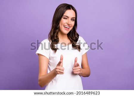 Photo of funky brunette millennial lady point camera blink wear white t-shirt isolated on violet color background