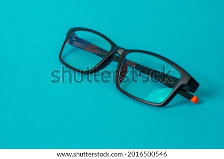 Anti-radiation glasses isolated on blue background, specially designed to protect the eyes from radiation such as sunlight, computer screens, or gadgets