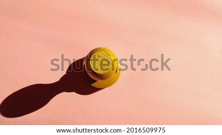 wooden stamp isolated on pink background. concept photo with space.
