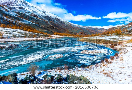 River valley in the snow mountains Royalty-Free Stock Photo #2016538736
