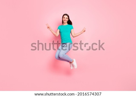 Full body profile side photo of young woman happy positive smile jumper show peace cool v-sign isolated over pastel color background