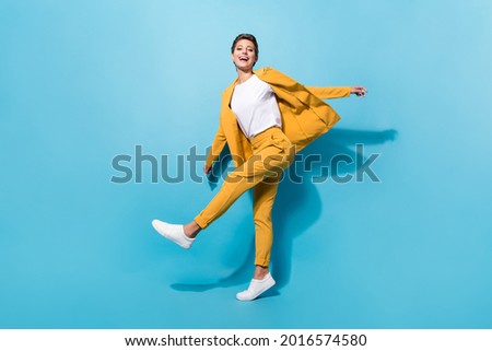 Full length body size view of pretty cheerful girl manager dancing having fun isolated over bright blue color background Royalty-Free Stock Photo #2016574580