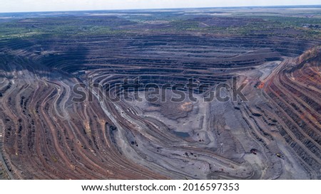 Open Iron Ore Quarry in summer day Aerial Top View