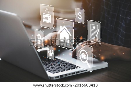 Businessman using a computer for property sales listings, realtor agency contractor, residential property, investment, housing project, property development real estate, choose a house buy online. Royalty-Free Stock Photo #2016603413