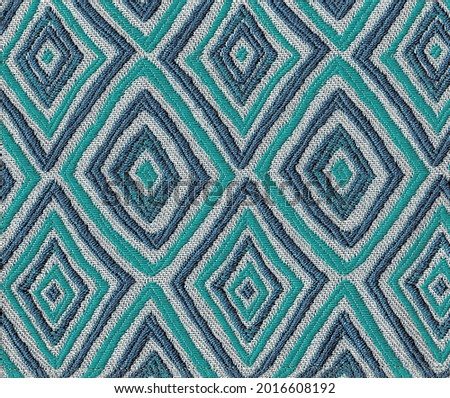 Close-up of the Fabric textile texture, background and wallpaper. The texture of fabric textile upholstery of furniture. High-quality photography.