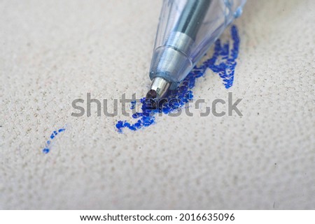 Ballpoint pen tip, scribbling on a white leather sofa, or car seats. Royalty-Free Stock Photo #2016635096