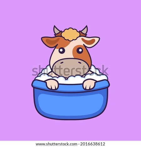 Cute cow taking a bath in the bathtub.