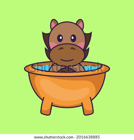 Cute horse taking a bath in the bathtub.