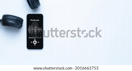 Podcast icon. Audio equipment with microphone, sound headphones, podcast application on mobile smartphone screen. Radio recording sound voice on white background. Broadcast media music concept Royalty-Free Stock Photo #2016662753