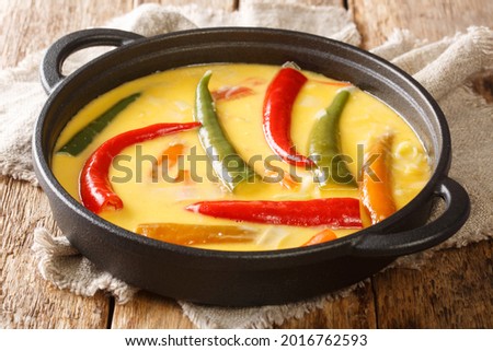 Ema Datshi Bhutanese Chili and Cheese Stew closeup in the pan on the table. horizontal
 Royalty-Free Stock Photo #2016762593