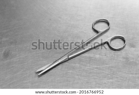 scissors surgical instrument on sterile table