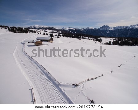 Drone photo of the Rodenecker and Lüsner Alm (Alpe di Rodengo e di Luson) in winter with a view of Sasso PutiaPeitlerkofel and the Dolomites  Royalty-Free Stock Photo #2016778154