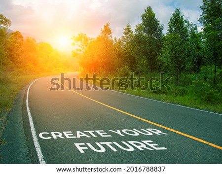 Create your future, concept photo of asphalt road. Encouraging quote on road. Summer forest landscape with curved highway. Inspirational quote banner. Motivational card. Future planning concept