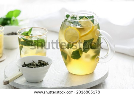 Tasty cold ice tea on table
