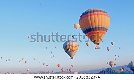Hot air baloons preparing for take off. Famous sightseeing Cappadocia. Lights of air balloons. Royalty-Free Stock Photo #2016832394