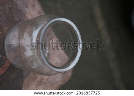 empty glass jar for food and drink on a wooden table