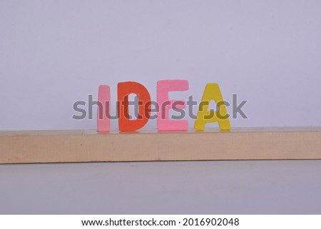 shot of an anagram made with colored wooden letters