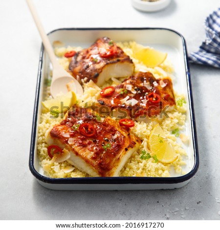 Roasted white fish with pepper crust and couscous