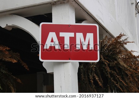 ATM sign on the side of a building