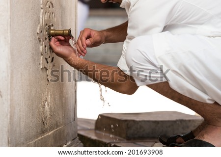 Islamic Religious Rite Ceremony Of Ablution Hand Washing Royalty-Free Stock Photo #201693908