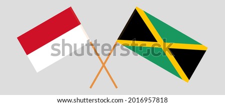 Crossed flags of Indonesia and Jamaica. Official colors. Correct proportion