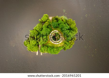 Top down aerial shot of old medieval castle tower on small island in middle of Lough Oughter in Inishconnell, Co. Cavan, Ireland Royalty-Free Stock Photo #2016965201