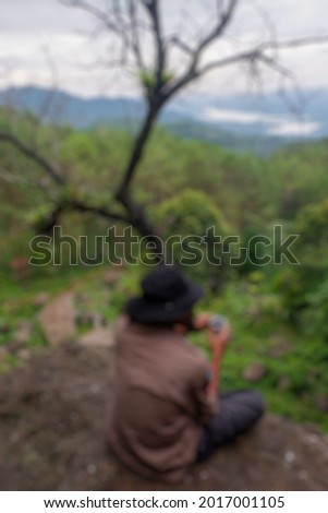 Blur photo of people in the fresh pine forest