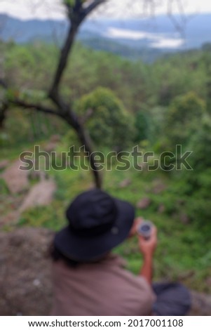 Blur photo of people in the fresh pine forest