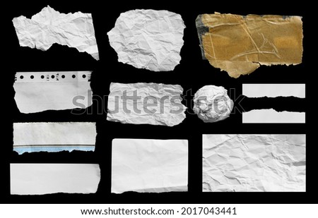 Ripped paper on black background, space for advertising copy. Royalty-Free Stock Photo #2017043441